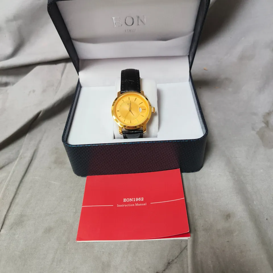 EON GOLD-TONE WRISTWATCH WITH BLACK LEATHER STRAP – BOXED