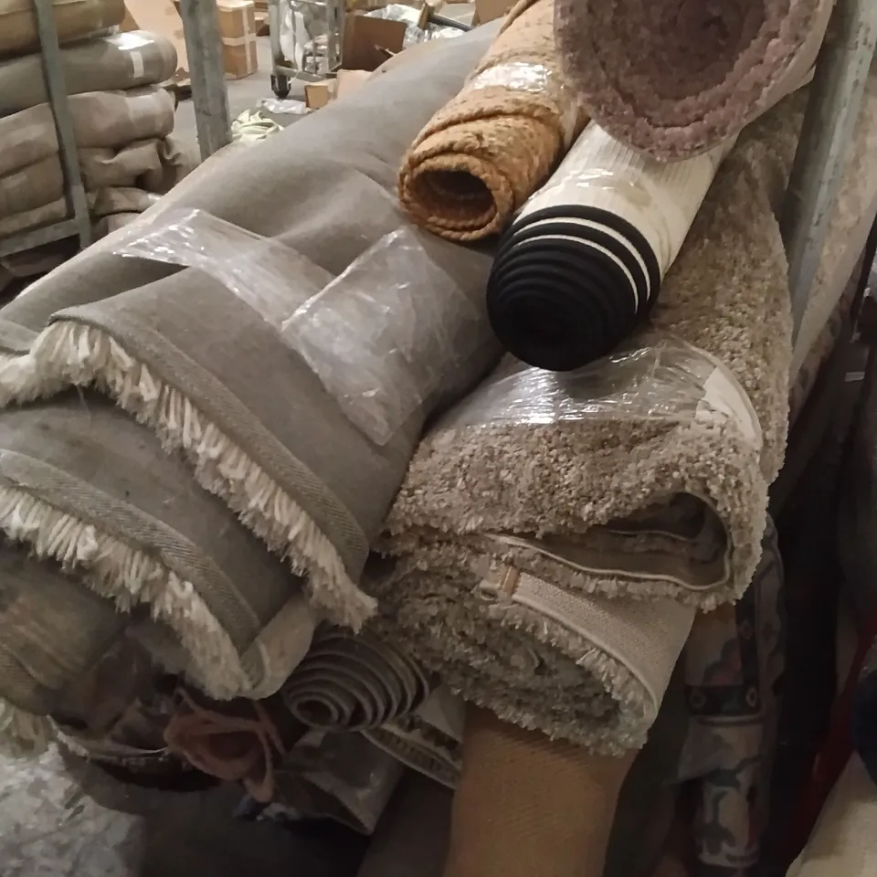STILLAGE OF DESIGNER RUGS APPROXIMATELY 14 LARGE RUGS