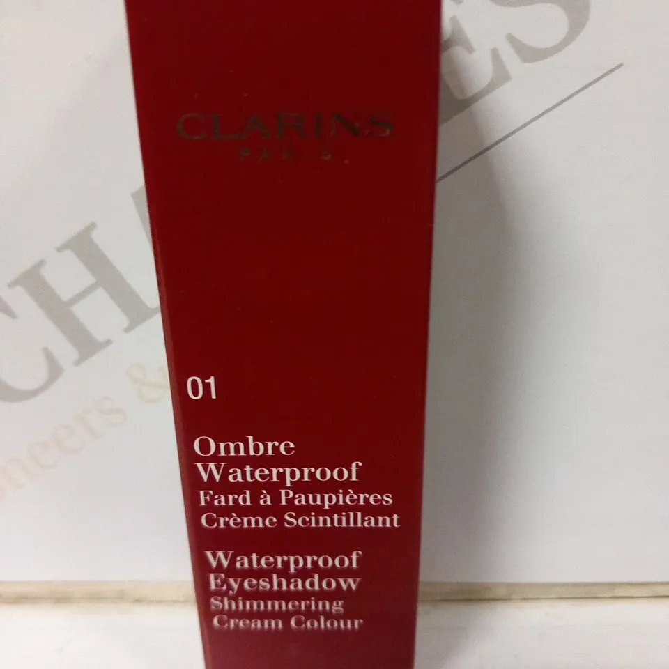 APPROXIMATELY 35 ASSORTED BOXED CLARINS PARIS OMBRE WATERPROOF EYESHADOW SHIMMERING CREAM COLOUR