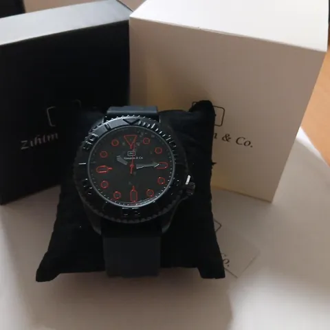 ZIHLMANN & CO. WRISTWATCH – BLACK WITH RED DIAL ACCENTS, BOXED