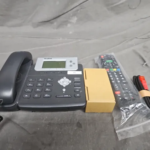 TOTE OF APPROXIMATELY 10 ASSORTED HOUSEHOLD ITEMS TO INCLUDE CABLES, REMOTE CONTROLS AND PHONES