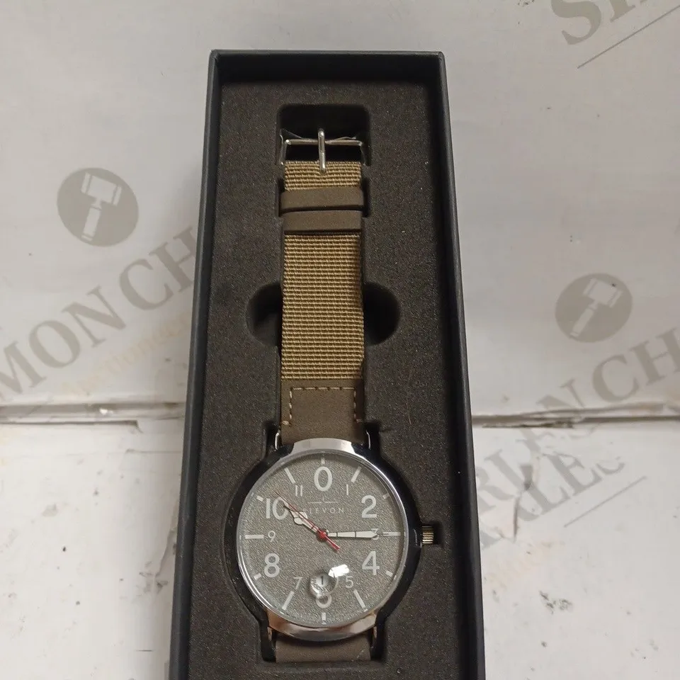 BOXED ELEVON WATCH - STAINLESS STEEL CASE BACK - JAPAN QUARTZ MOVEMENT - WATER RESISTANT 5 ATM - MAGNIFIED DATE. 