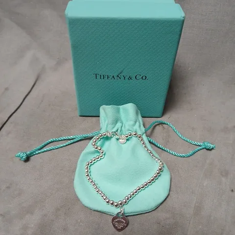 TIFFANY & CO. SILVER BEAD BRACELET WITH TURQUOISE HEART CHARM