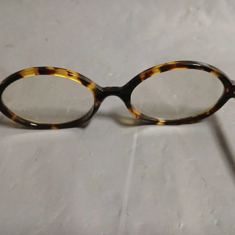 BOXED PAIR OF MIU MIU BROWN PATTERENED GLASSES