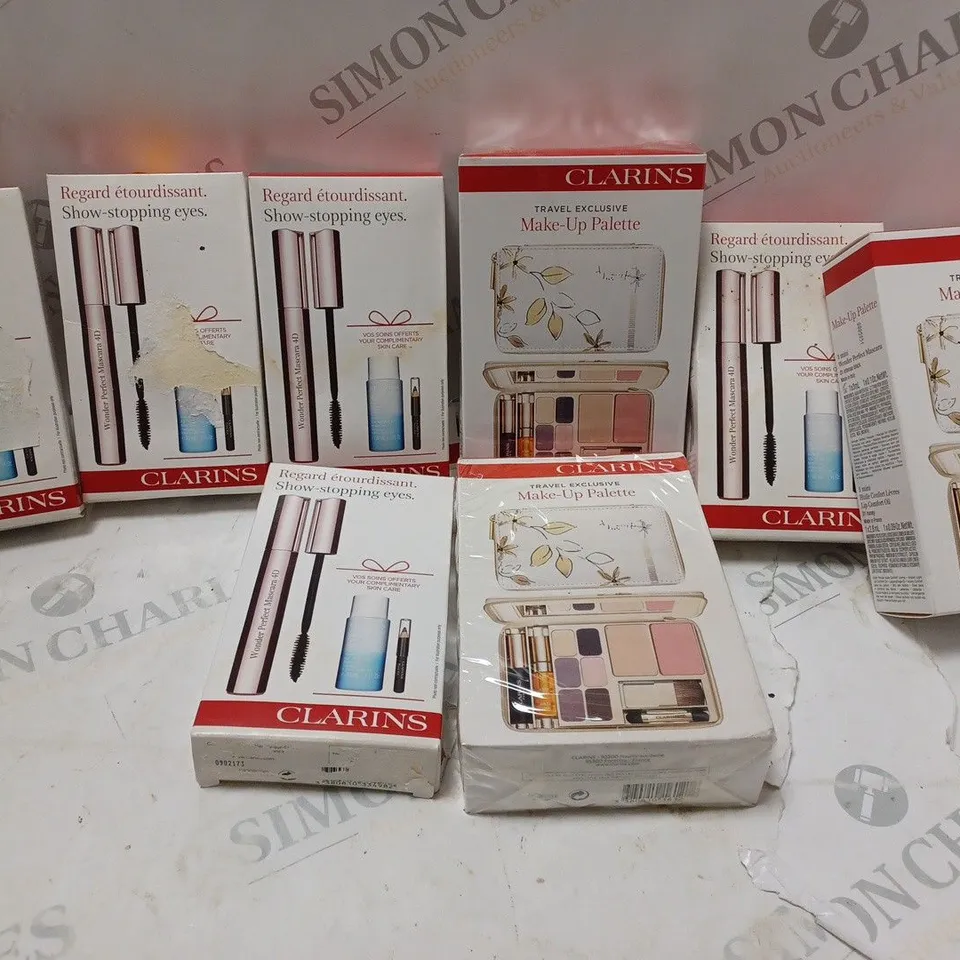 APPROXIMATELY 8 ASSORTED CLARINS PRODUCTS TO INCLUDE TRAVEL EXCLUSIVE MAKE-UP PALETTE, SHOW STOPPING EYE SET