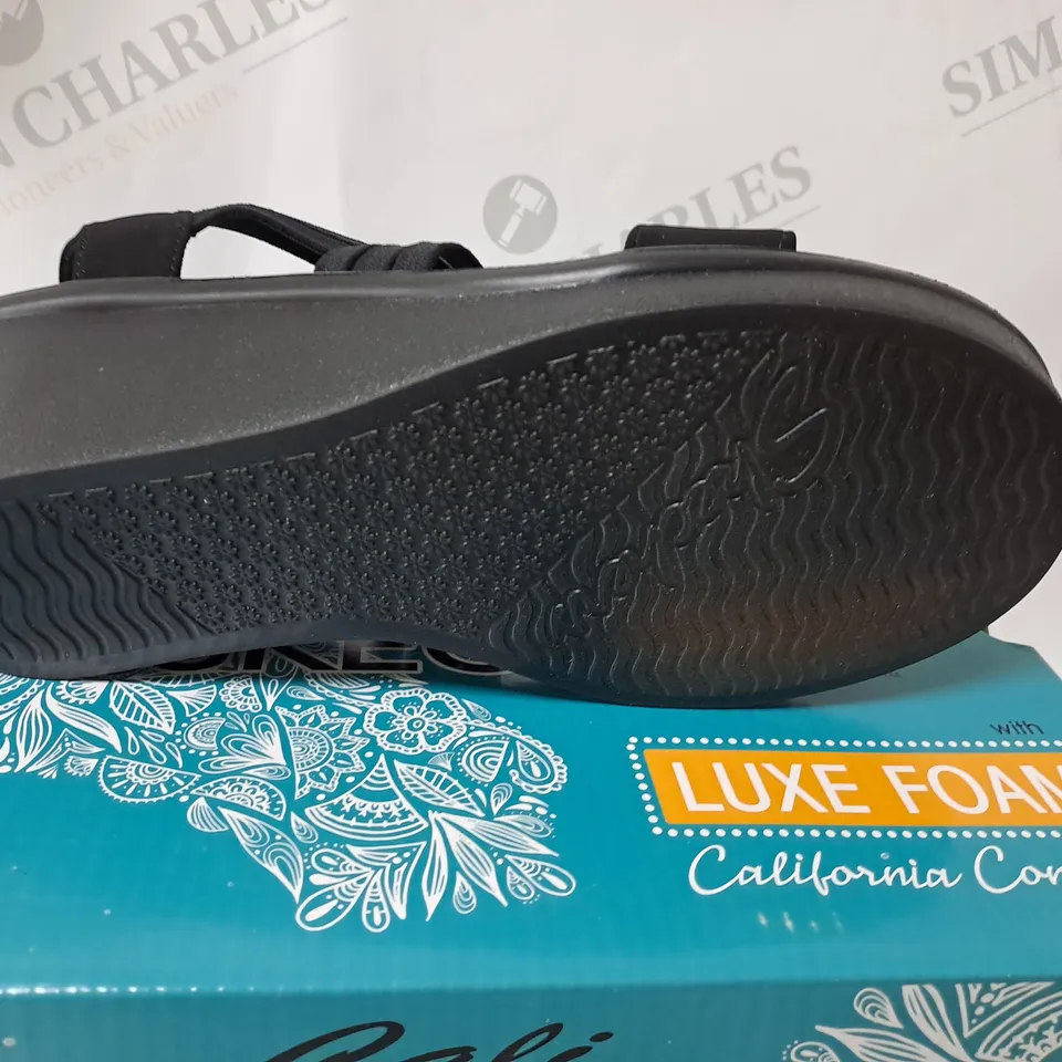 boxed cali from sketchers in black size 6 