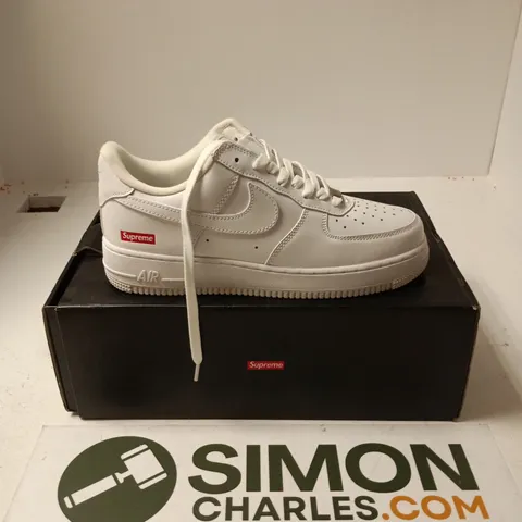 BOXED PAIR OF NIKE AIR FORCE 1 LOW SUPREME TRAINERS IN WHITE - UK 7.5