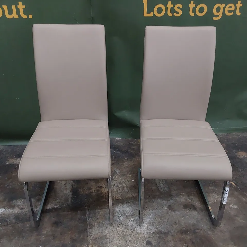PAIR UPHOLSTERED DINING CHAIRS FAWN PU ON CHROME FRAMES 