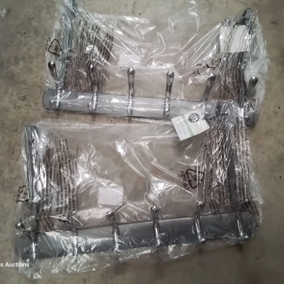 PALLET OF ASSORTED ITEMS INCLUDING CAT BAGS, BANKSY 2023 CALENDARS, BADMINTON SETS, FOOTBATHS, OVER-DOOR COATHOOKS, READING PILLOWS