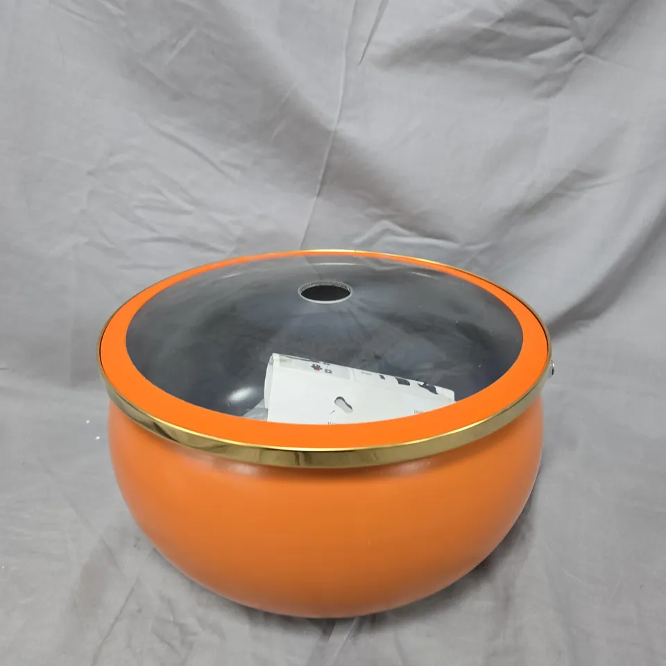 ROUND ORANGE CASSEROLE DISH WITH GLASS VENTED LID AND BRASS RIM